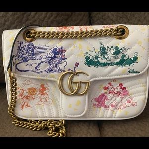 White quilted Mouse crossbody bag.